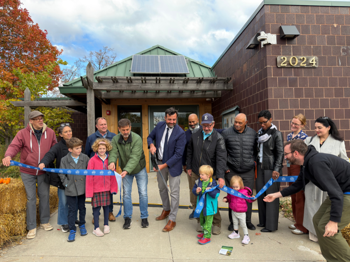 people cutting blue ribbon